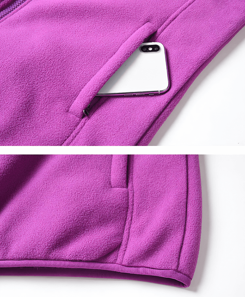 Purple thermal fleece jacket with stand collar and zipper pocket, perfect for outdoor sports. Features a phone pocket for convenience.
